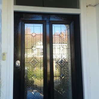 black pre-glazed external door