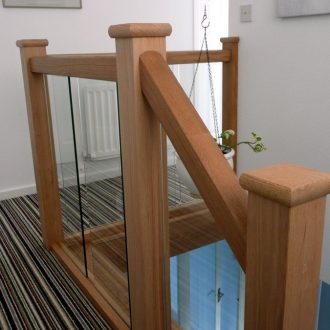 wood and glass stairs and banister